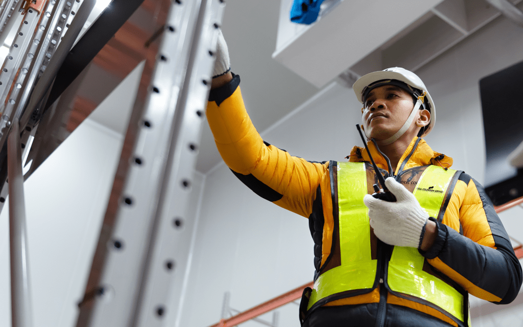 Coldstore engineer performing maintenance inspection in a coldroom