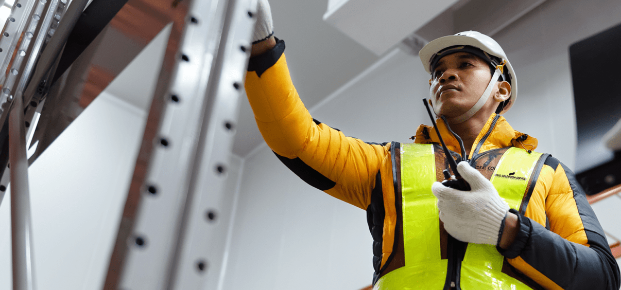 Coldstore engineer performing maintenance inspection in a coldroom